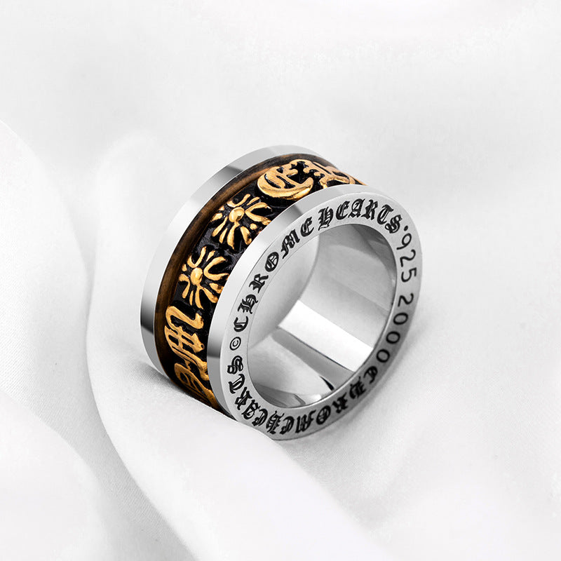chrome hearts black and gold rotating letter cross flower ring