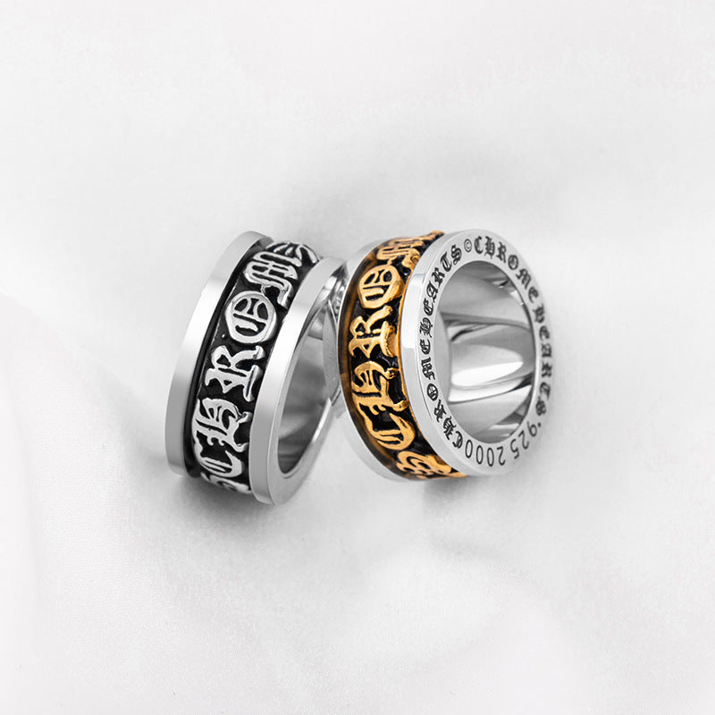 chrome hearts black and gold rotating letter cross flower ring