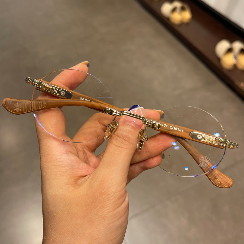 Chrome Hearts frameless round punched retro glasses